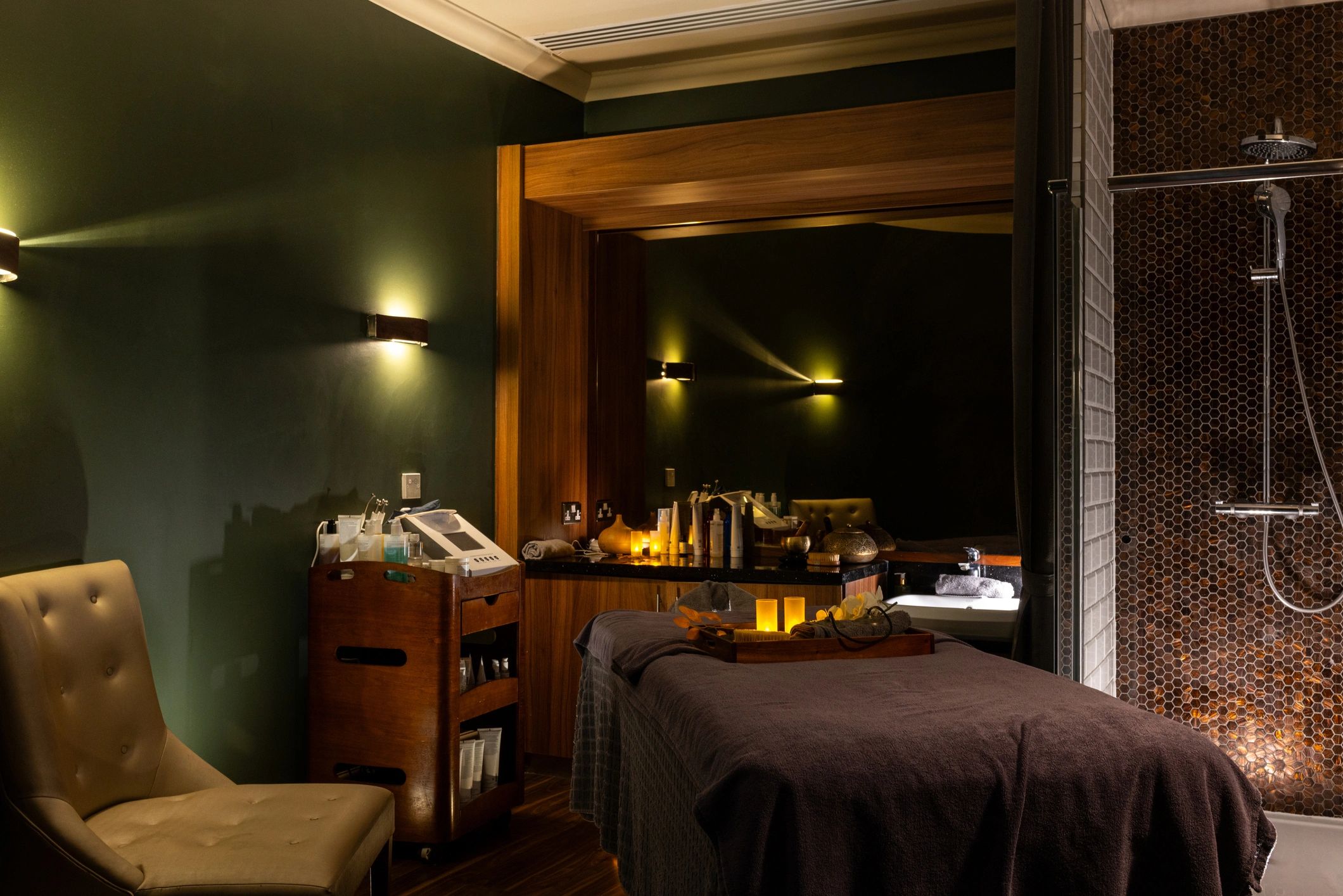 Cozy spa relaxation room with massage bed